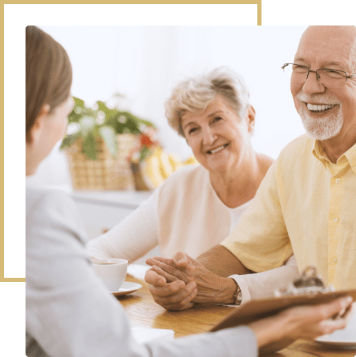 Senior couple consulting with advisor.