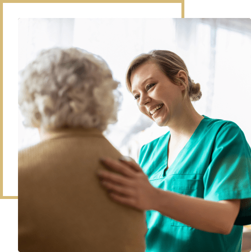 Caregiver comforting elderly woman.
