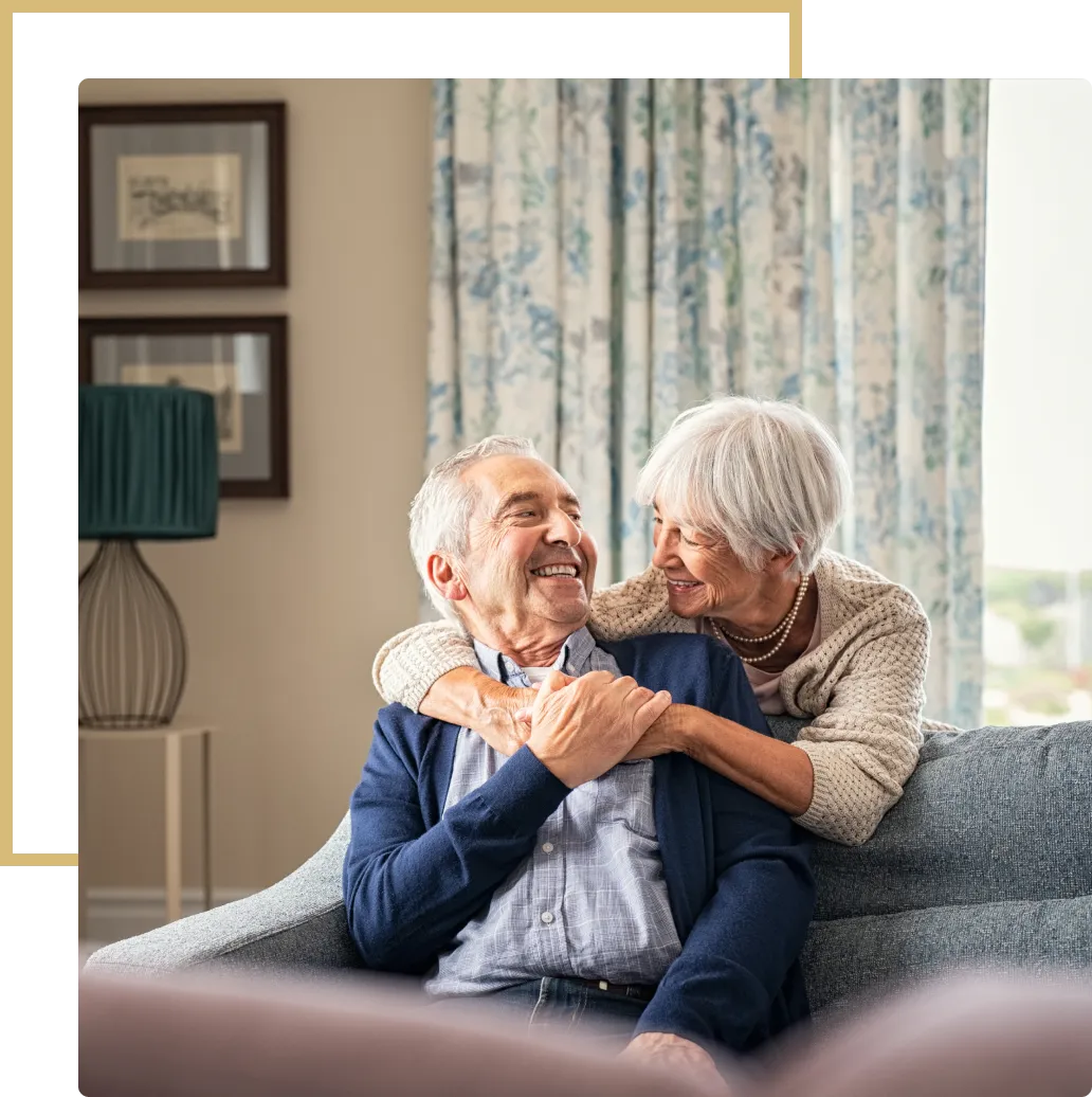 A man and woman sitting on top of a couch.