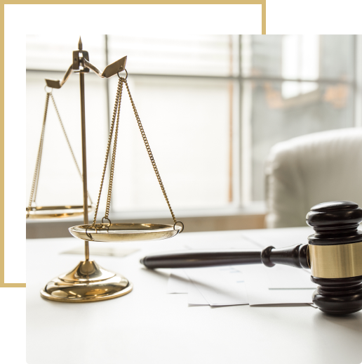 322 A judge 's gavel and scale on top of a table.